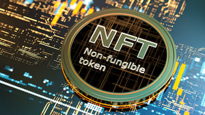 Circular token bearing the words: NFT Non-fungible token.
